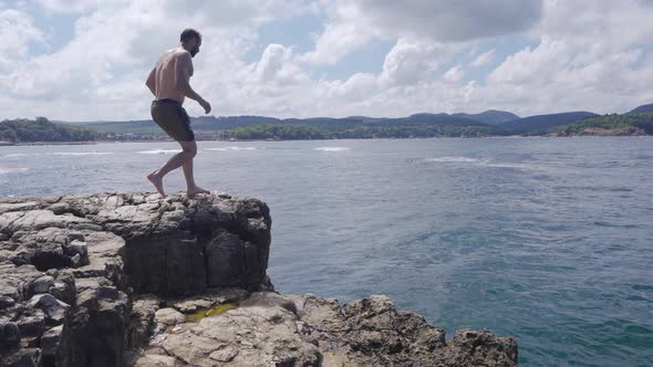 Jumping From A Rock. alt