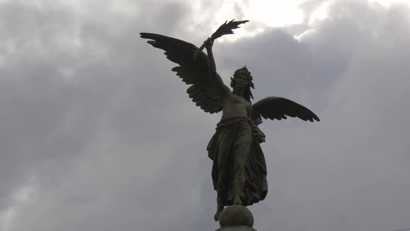 Statue on a cloudy day alt