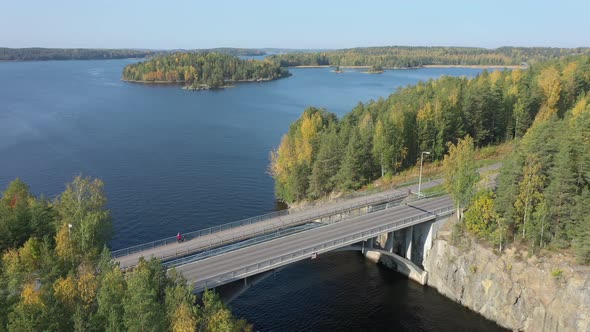 An Aerial View of the Long Bridge with the Trees in Lake Saimaa in Finland