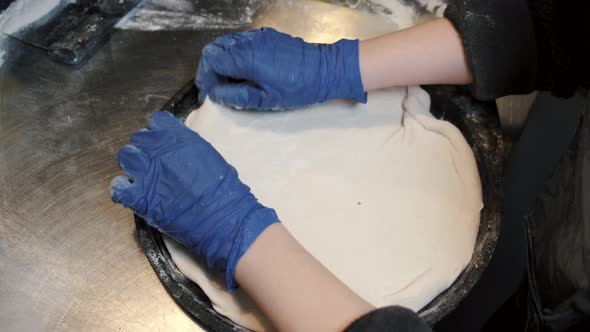 Rolling the Pastry Dough on a Flat Surface alt