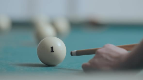 The Billiard Ball Number One is Hit with a Cue alt