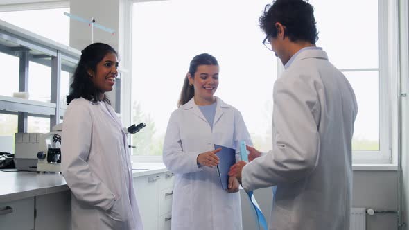 Scientists Shaking Hands in Laboratory
