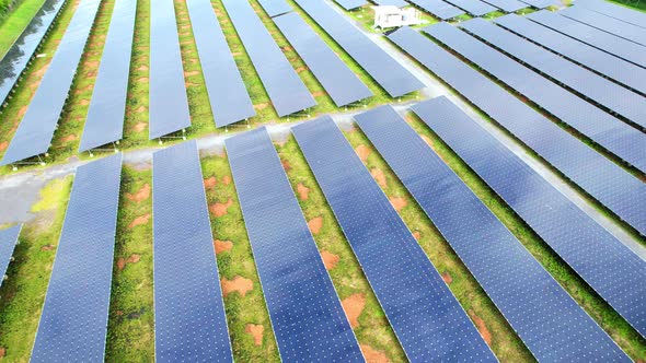 Drone fly over solar farm, renewable energy from solar. alt