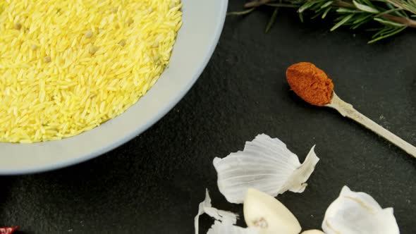 Rice in bowl with various spices ingredients 4k alt