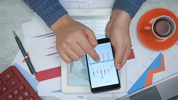 Broker Analyzing Stock Report On Smart Phone
