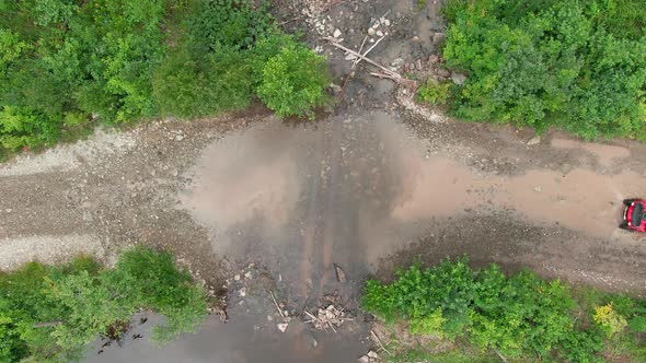 Aerial Shot of Man Driving Quad Bike alt