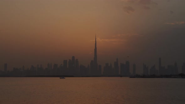 Day to Night Timelapse of Dubai Skyscrapers During Sunset alt