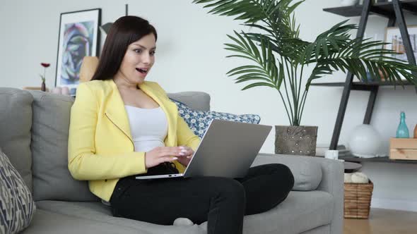 Wow Excited Woman Surprised By Results While Working on Laptop alt