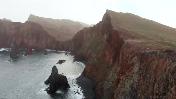Flying Over Rugged Coastline of Madeira Island, Portugal alt