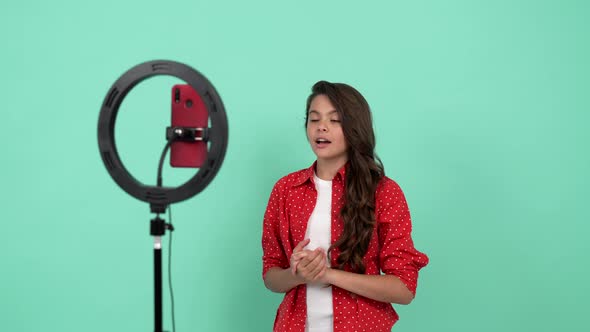 Smiling Teen Girl Talking on Camera Online Courses at School Elesson Online Education alt