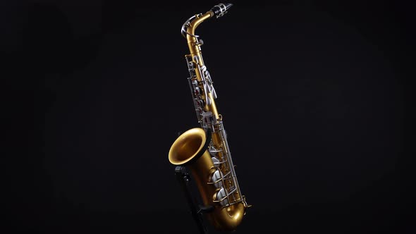 Rotating Golden Saxophone On A Black Background.