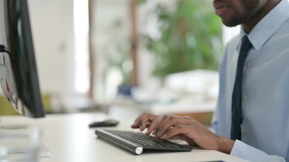 Hands of Businessman Typing on Keyboard Close Up alt