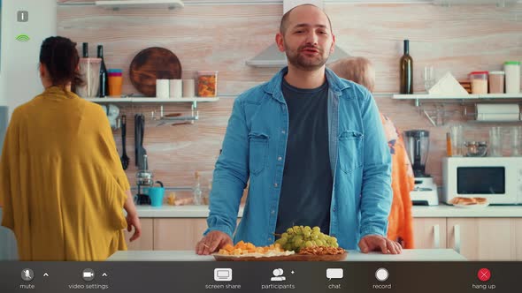 Man Talking During Video Call in the Kitchen alt