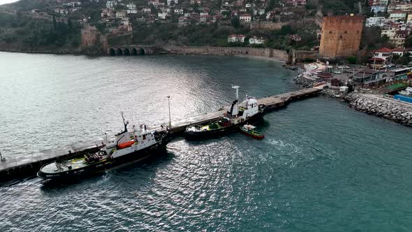Tugboat to mooring Aerial View 4 K Turkey Alanya alt