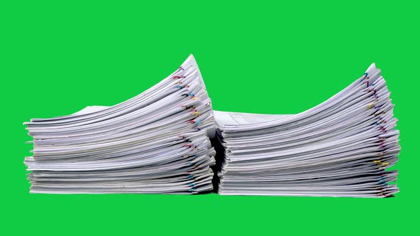 Stop motion animation Stacks overload document paper files on chroma key green screen