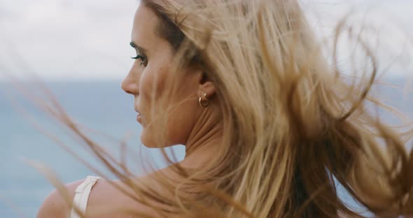 Wind blowing in her hair alt