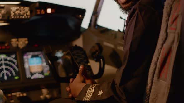 Portrait of Male Captain Sitting in Airplane Cockpit to Start Engine alt