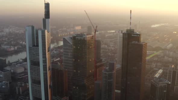 AERIAL: View of Frankfurt Am Main, Germany Skyline with Sunflair Between Skyscrapers in Beautiful alt