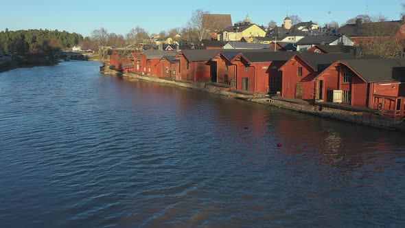 Moving Towards the Red Wooden Riverside Houses in Porvoo Finland alt
