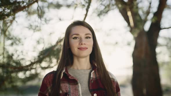 Portrait of a Beautiful Young Woman in a Casual Shirt alt