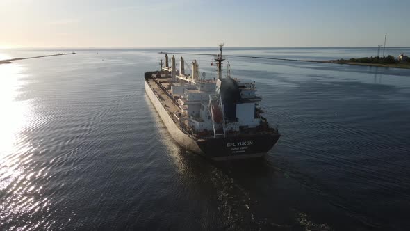 Ship leaving river for sea alt