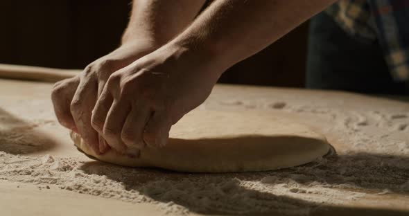 Experienced Cooker Making Pizza Using Traditional Recipe