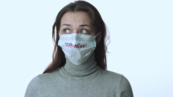 Girl in Protective Mask Afraid of Coronavirus Pandemic Nervously Looks Around alt