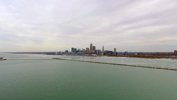 Wide revealing drone shot of downtown Cleveland Ohio and Lake Erie alt