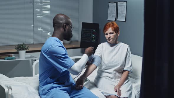 Nurse Getting Blood Pressure of Patient alt