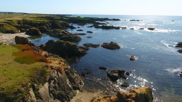 Stunning Coastal Beaches of California with Scattered Rocks in Waters alt