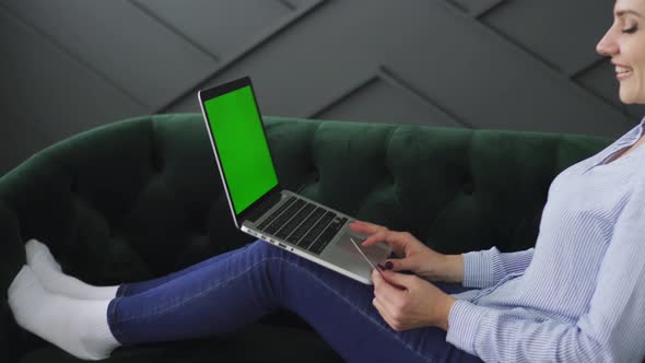 Young Woman Rejoices for Successful Online Payment By Credit Card alt