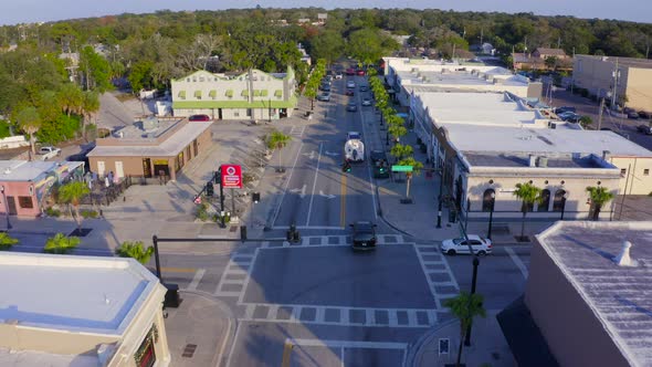 Forward Aerial of Cars on the Main Road in a Small Town in Florida alt