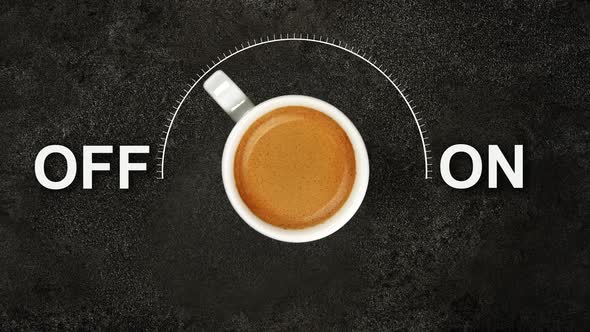 Cup of espresso coffee and on off power switch alt