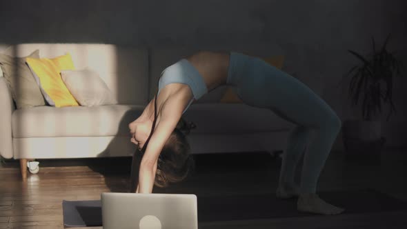 Flexible Woman Practicing Yoga Online