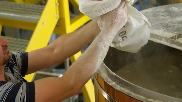 Male workers preparing gin in distillery 4k alt