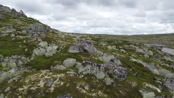 Revealing highway rv7 over Hardangervidda mountain plateu - Road crossing mountains between east and alt