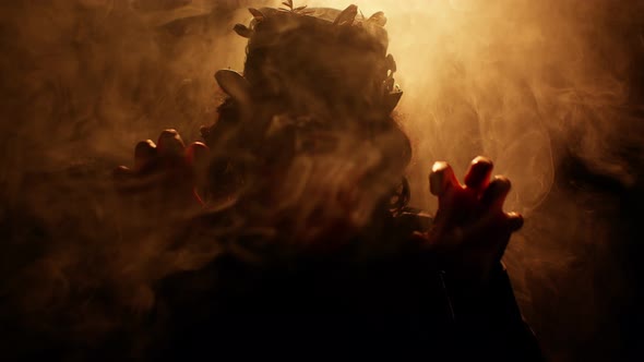 Sinister Man with Horrible Scary Halloween Witcher Makeup in Costume Making Faces Trying to Scare alt