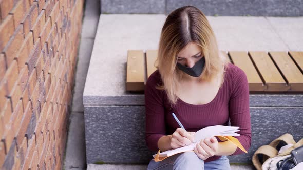 Female Student Studies Remotely in Outdoor Park