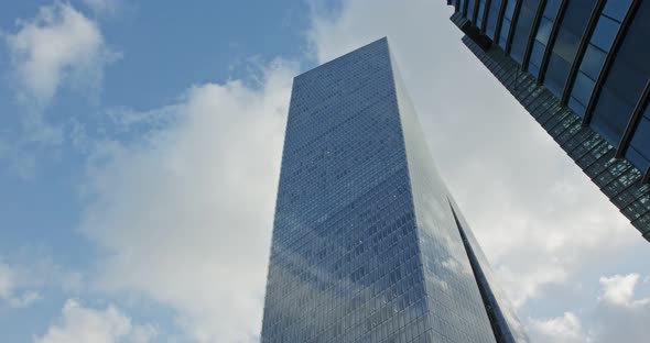 Timelapse of modern glass skyscraper in Tel Aviv, Israel with cloud relfections alt