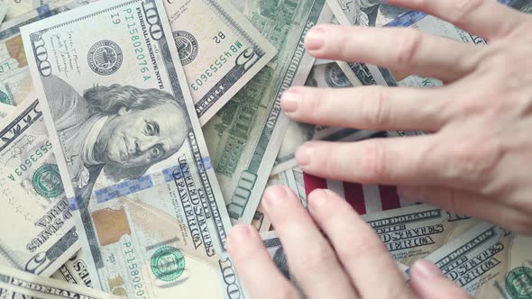 Hands Moving Hundred Dollars Banknotes From Usa National Flag alt