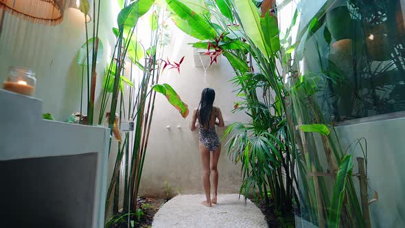Back View Sexy Girl Alone In Exotic Shower Bathroom Luxurious Resort with Plants alt