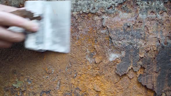 Closeup View  the Hand is Cleaning the Rust alt