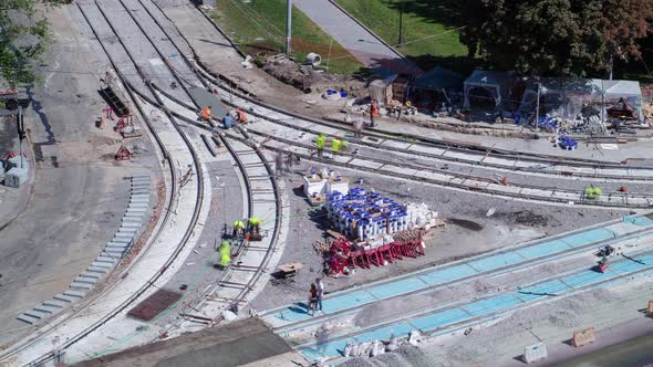 Road Construction Site with Tram Tracks Repair and Maintenance Aerial Timelapse alt