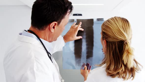 Doctors checking x-ray report alt