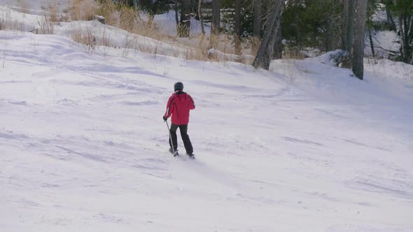 Skier Skiing and People on Snowboards Ride Down the Slope on Ski Resort in Mountains Winter. alt