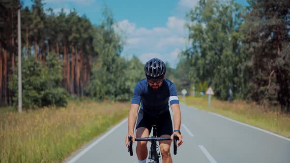 Cyclist Training Leisure Twists Pedals On Triathlon Bicycle. Gear System  And Bike Wheel. Workout. alt