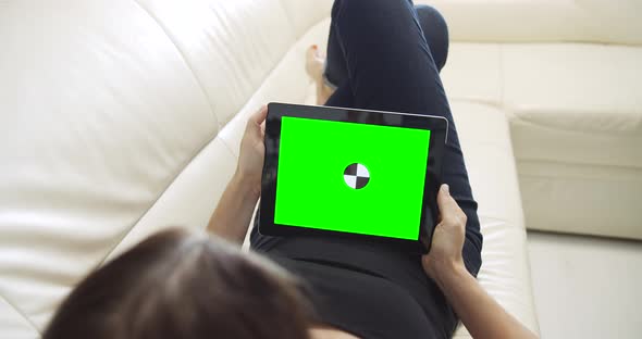 Woman with Tablet Chromakey Lying on Sofa