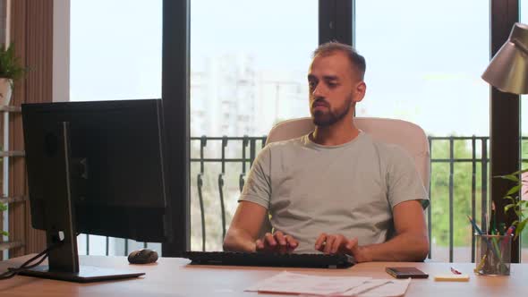 Office Employee Typing on Computer Keyboard alt