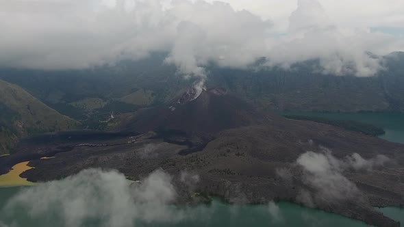 Flying towards active volcano inside a crater, Rinjani on Lombok in Indonesia alt