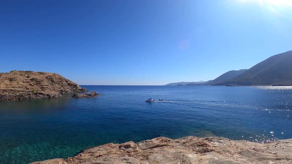 Feet Walking on Narrow Rocky Cliff above Sea. Point of view, POV of person walking alt
